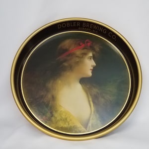 A. Asti&#39;s portrait of a lovely young woman adorns this beer serving tray for the Dobler Brewing Co. of Albany, NY Excellent condition