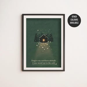 May include: Framed art print featuring a cabin in a snowy forest scene. The artwork has a dark green background with the text "Forgive my northern attitude I was raised out in the cold." A black circle indicates other colors are available.