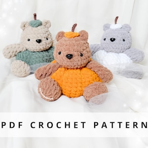 May include: Three handmade crochet teddy bears in beige, brown, and grey, each with a unique colour scheme. The bears have black button eyes and small, decorative accents. The text "PDF CROCHET PATTERN" is displayed at the bottom.