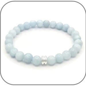 May include: A light blue gemstone bracelet with a silver bead accent. The bracelet is made of round beads and is approximately 7 inches in length.