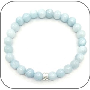 May include: A light blue gemstone bracelet with a silver bead accent. The bracelet is made of round beads and is approximately 7 inches in length.