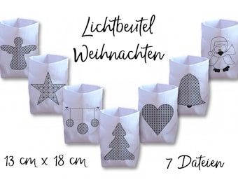 Puede incluir: Farolillos de papel blanco con diseños navideños negros, incluyendo un ángel, una estrella, adornos, un árbol de Navidad, un corazón, una campana y un pingüino. Miden 13 cm x 18 cm. El texto de la imagen dice "Lightbag Weihnachten" y "7 archivos".