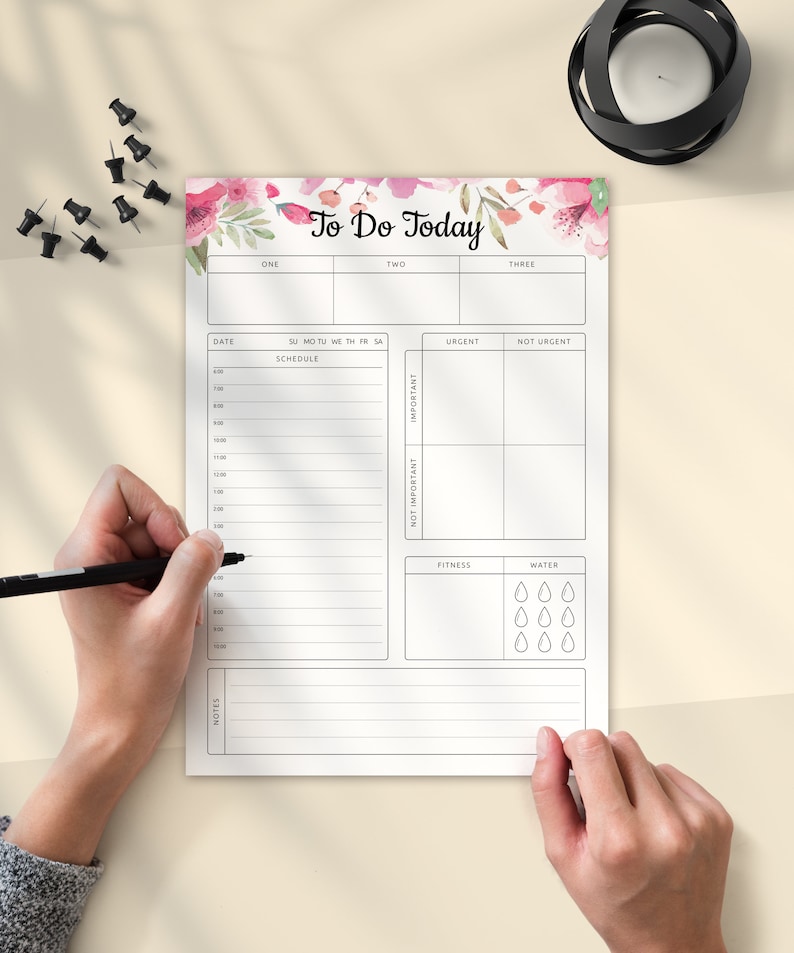 May include: A white to-do list with a floral design at the top. The list includes sections for schedule, urgent, not urgent, important, not important, fitness, and water. The list also includes a section for notes.