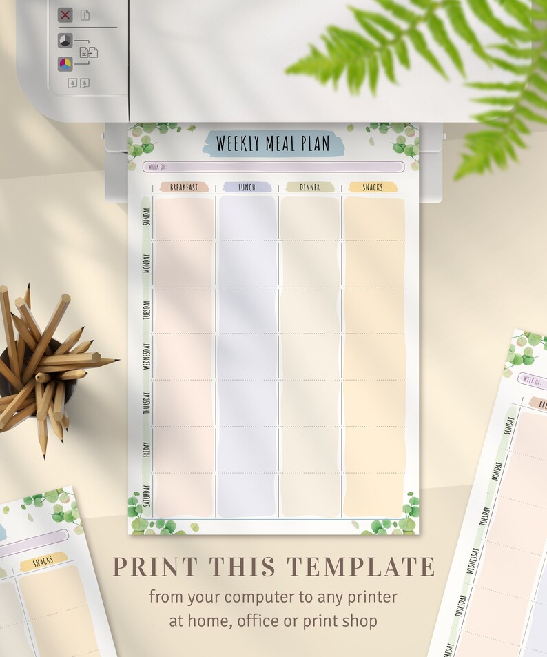May include: A printed weekly meal plan template with sections for breakfast, lunch, dinner, and snacks. The template is being printed from a white printer. The text "WEEKLY MEAL PLAN" is at the top. The text "PRINT THIS TEMPLATE" is at the bottom.