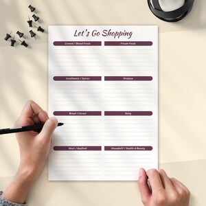 May include: A printable grocery list with the title "Let's Go Shopping" and categories for Canned/Boxed Foods, Frozen Foods, Condiments/Spices, Produce, Bread/Cereal, Dairy, Meat/Seafood, and Household/Health & Beauty.