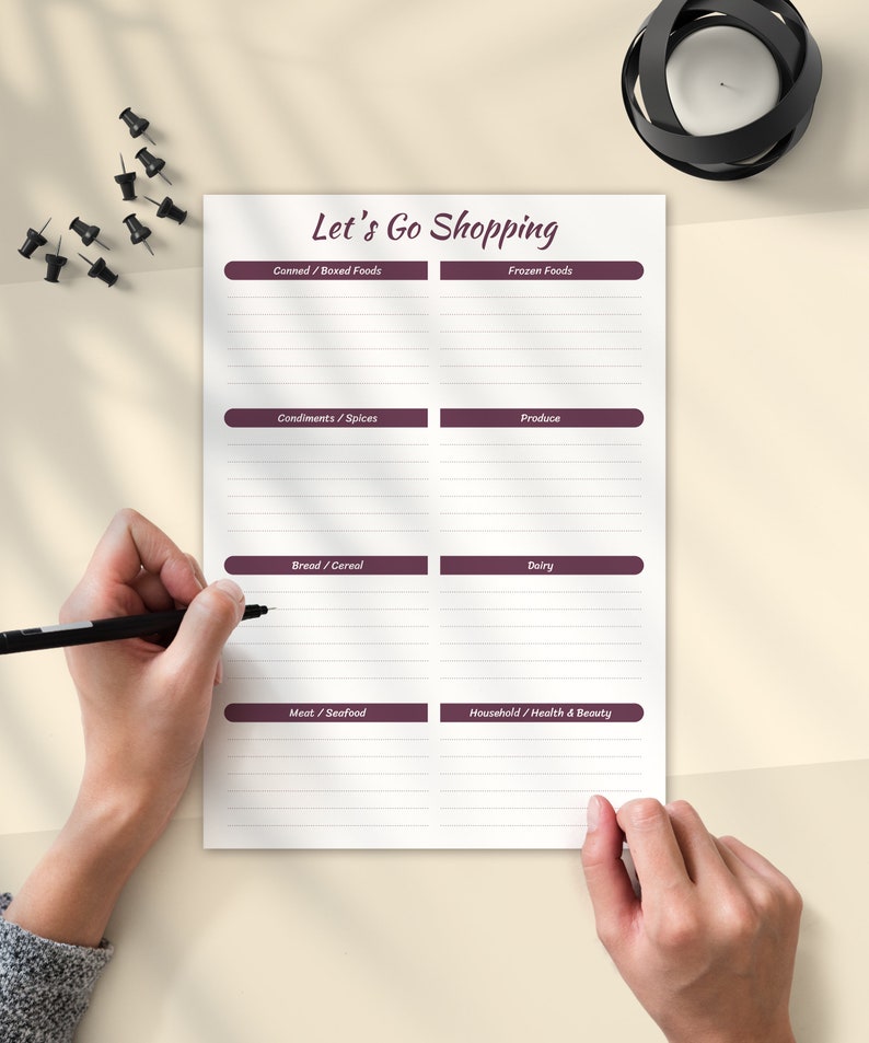 May include: A printable grocery list with the title "Let's Go Shopping" and categories for Canned/Boxed Foods, Frozen Foods, Condiments/Spices, Produce, Bread/Cereal, Dairy, Meat/Seafood, and Household/Health & Beauty.
