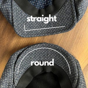 May include: Two tweed newsboy caps, one with a straight brim and the other with a rounded brim. The caps are blue and gray with a black elastic band. The interior lining of the caps is a dark blue with a small white dot pattern. The word "straight" is written on one cap and "round" on the other.