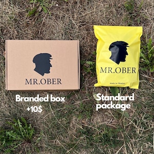 May include: A branded cardboard box and a yellow standard package, both featuring the "MR.OBER" logo with a silhouette of a person wearing a cap. The box is labeled "Branded box" and the package is labeled "Standard package".