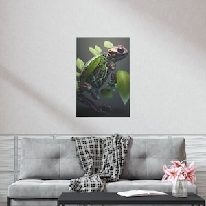 May include: A digital art print featuring a robotic frog with a body composed of green foliage and mechanical components. The frog has purple eyes and is surrounded by green leaves against a dark background. The artwork is displayed on a wall.