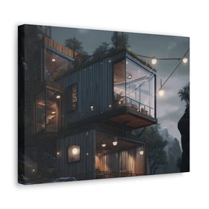 May include: Canvas print depicting a modern home built into a mountainside. The building has large glass windows, wooden cladding, and fairy lights. The artwork has a moody, atmospheric feel with a dark colour palette.