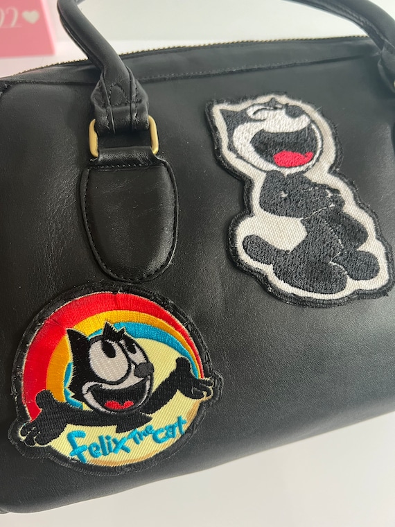 Coach cat purse sale