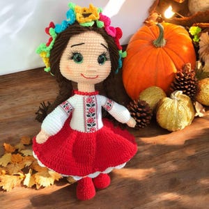 Knitted toy doll, soft toy, amigurumi doll.