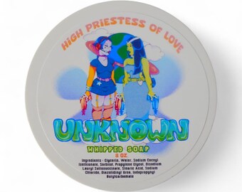 May include: A round, white container of whipped soap with the text "HIGH PRIESTESS OF LOVE" and "UNKNOWN" in colorful lettering. The label features a cartoon illustration of two figures. The container holds 8 oz of soap.