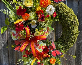 Beautiful moss and floral wreath for your door.  Perfect for Mother’s Day.