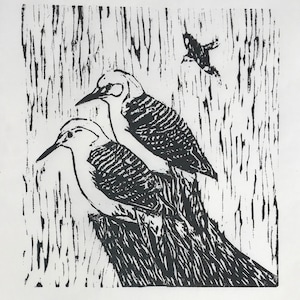 woodcut print of a pair of woodpeckers by Margot Torrey, Vermont-based artist