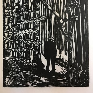 woodcut print of a hiker entering deep woods, by Vermont artist Margot Torrey