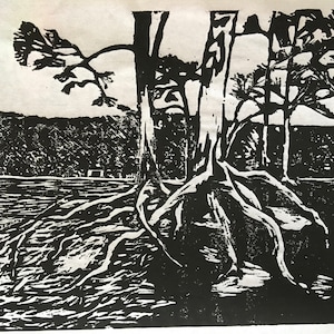 May include: Black and white woodcut print of a tree with exposed roots and a forest in the background.