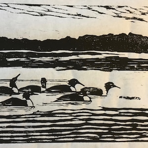woodcut print of Mergansers in lake by Margot Torrey
