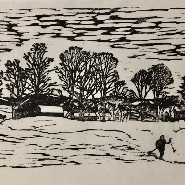 woodcut print of a cross-country skier in a field with barns and maple trees by Vermont artist Margot Torrey