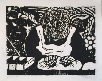 Woodcut print of old woman kneading bread, titled Lammas, by Vermont artist Margot Torrey