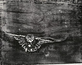 woodcut print of an owl flying in a dark sky by Vermont artist Margot Torrey