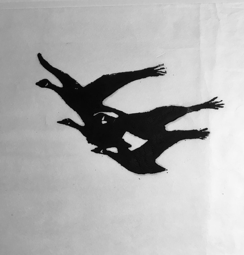 May include: Black and white silhouette of three geese flying in formation.