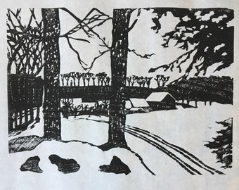 woodcut image of a snowy field and ski tracks with a barn in the distance, by Vermont-based artist Margot Torrey