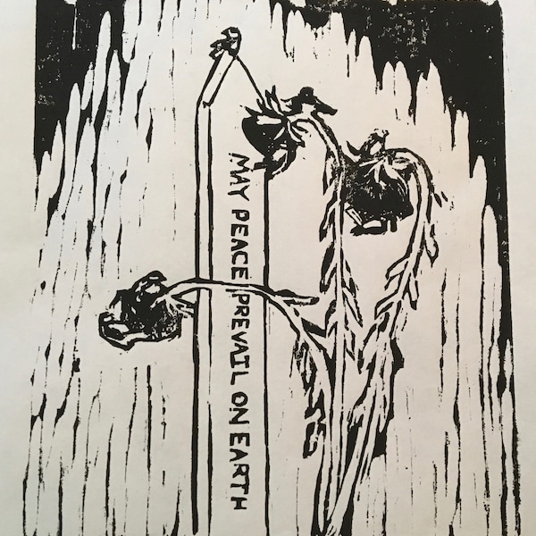 woodcut print depicting "May Peace Prevail on Earth" Peace Pole and sunflowers by Vermont artist Margot Torrey