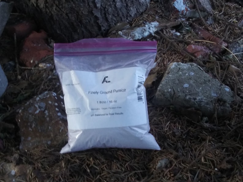 May include: A white plastic bag with a label that reads "Finely Ground Pumice 1 lb(s) / 16 oz pH Balanced for Best Results".