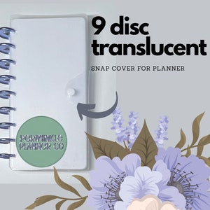 May include: A clear translucent 9 disc planner cover with a snap closure. The cover is designed to fit a 9 disc planner. The cover has a sticker on the front that says "Periwinkle Planner Co."