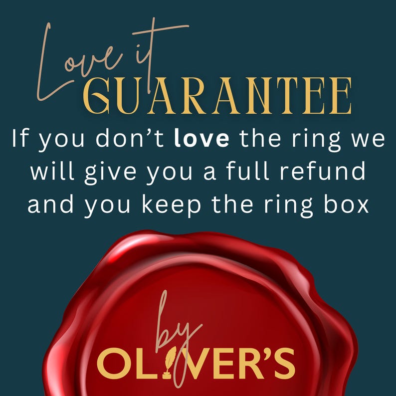 May include: A dark teal graphic featuring the text Love it GUARANTEE. If you don't love the ring we will give you a full refund and you keep the ring box. Below the text is a red wax seal graphic with the gold text by OLIVER'S printed on it.