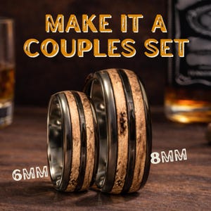 May include: Two rings featuring a dark metallic band with a central inlay of textured light brown wood. The text MAKE IT A COUPLES SET is displayed above, with 6MM and 8MM labels indicating the width of each ring respectively.