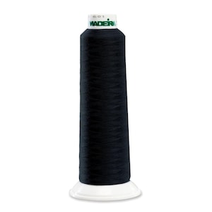 May include: A spool of black thread with a white base. The thread is tightly wound around a conical core. The top of the spool has a green and white label with the brand name "Madeira" and the number "601".