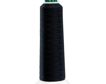 May include: A spool of black thread with a white base. The thread is tightly wound around a conical core. The top of the spool has a green and white label with the brand name "Madeira" and the number "601".