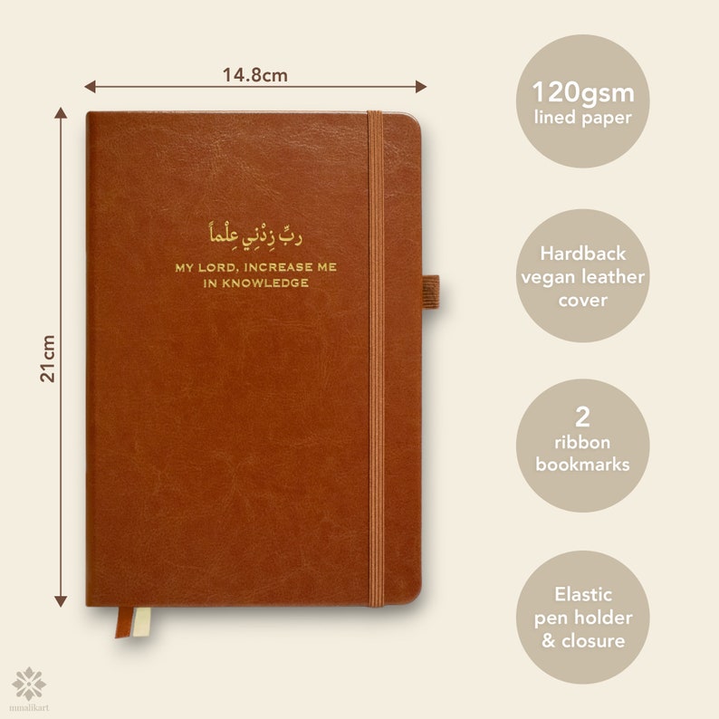 May include: Brown vegan leather journal with a gold inscription that reads "ربِّ زِدْنِي عِلْماً" which translates to "My Lord, Increase Me In Knowledge". The journal measures 8.6 inches by 11 inches and has a hardback cover, two ribbon bookmarks, and an elastic pen holder.