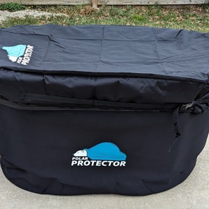 May include: Black outdoor furniture cover with the "POLAR PROTECTOR" logo. The cover is made of a durable material and has a drawstring closure. The cover is designed to protect outdoor furniture from the elements.