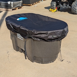 May include: Black plastic storage container with a black cover. The cover has the words "Pool Protector" printed on it in blue. The container is sitting on a concrete surface.