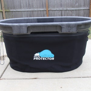 May include: A large, gray plastic stock tank with a black insulated cover. The cover features the text "POLAR PROTECTOR" with a blue cloud and bear logo. The tank sits on a concrete surface.