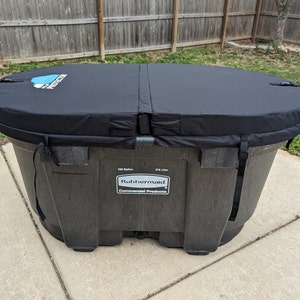 May include: Black oval-shaped hot tub cover with a blue and white logo that says "Pool Protector". The hot tub is made of black plastic and has a label that says "Rubbermaid Commercial Products".