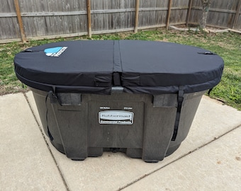 May include: Black oval-shaped hot tub cover with a blue and white logo that says "Pool Protector". The hot tub is made of black plastic and has a label that says "Rubbermaid Commercial Products".