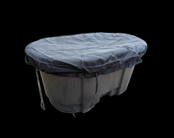 May include: A black plastic oval-shaped container with a black fabric cover. The cover has a drawstring closure and is pulled tight around the container.