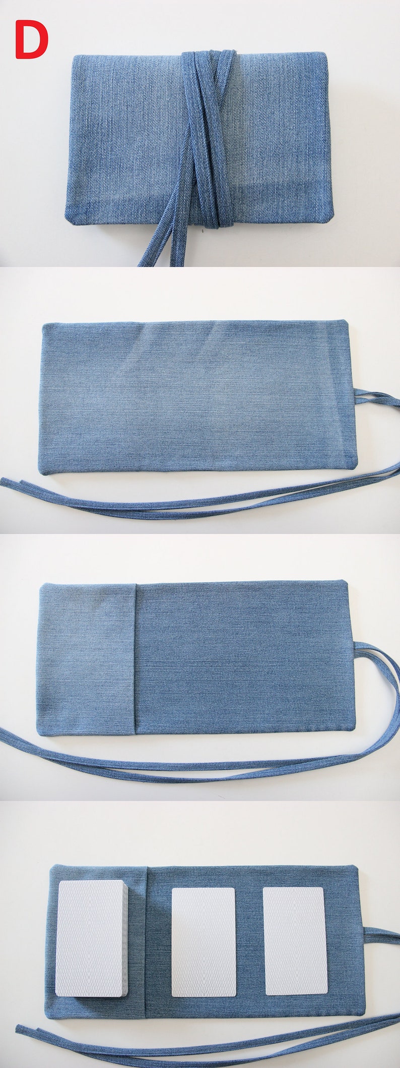 Puede incluir: Una bolsa de mezclilla con cierre de solapa y una correa larga. La bolsa est&aacute; abierta para revelar tres compartimentos rectangulares blancos.