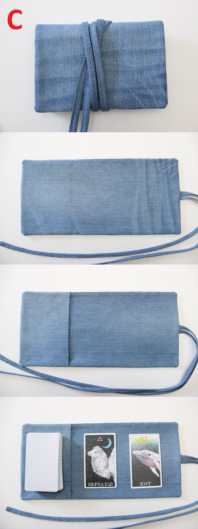 Puede incluir: Una bolsa de tarot de mezclilla azul con cierre de solapa y cierre de corbata. La bolsa est&aacute; abierta y muestra una baraja de cartas de tarot con dos cartas visibles. Las cartas est&aacute;n tituladas "Kit" y "Верблюд".