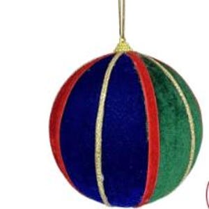 May include: A spherical holiday ornament featuring alternating vertical panels of blue, red, and green velvet fabric. The segments are separated by thin, shimmering gold glitter trim. A gold-colored cap sits at the top with a thin gold hanging cord.