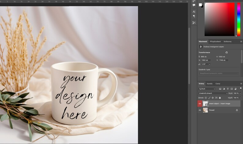 May include: White ceramic mug with a black handwritten inscription that reads "your design here" on a white fabric background with dried wheat stalks and green leaves.