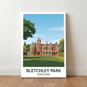 May include: A framed print featuring a stylized illustration of Bletchley Park in England. The artwork depicts a large brick building with a clock tower, set against a blue sky and green lawn. Text at the bottom reads "Bletchley Park England."