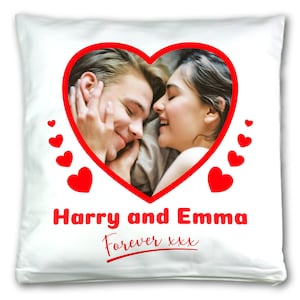 May include: White pillow with a red heart-shaped frame around a photo of a couple. The text "Harry and Emma Forever xxx" is printed below the photo.