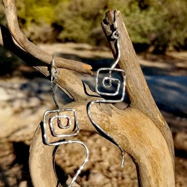 Modern silver hoop earrings inspired by greek key