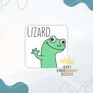 May include: A green lizard embroidered patch with the word "LIZARD" above it. The lizard is smiling and waving. The patch also includes the text "BABY EMBROIDERY GOODS" and a crown.