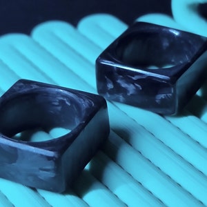 Modern minimalist forged carbon fibre square statement ring
